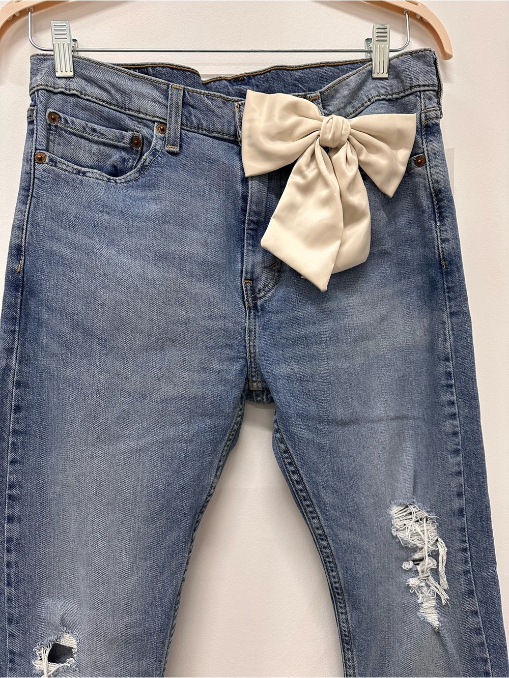 Levi's Light Blue Distressed Boyfriend Jeans with Cream Bow